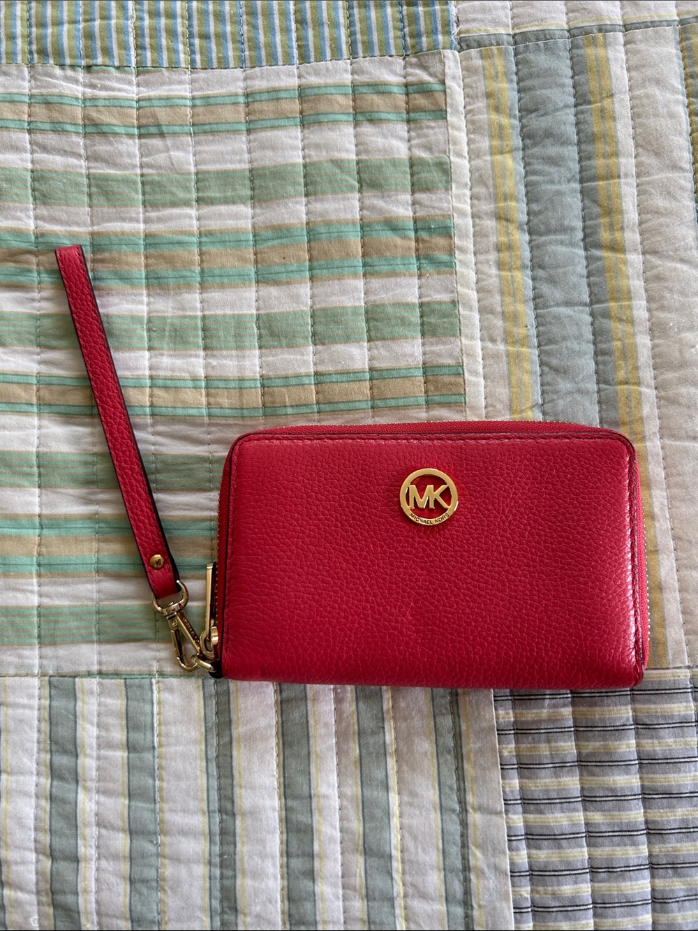 Michael Kors Pinkish Red Pebbled Leather Wristlet with Gold MK Emblem